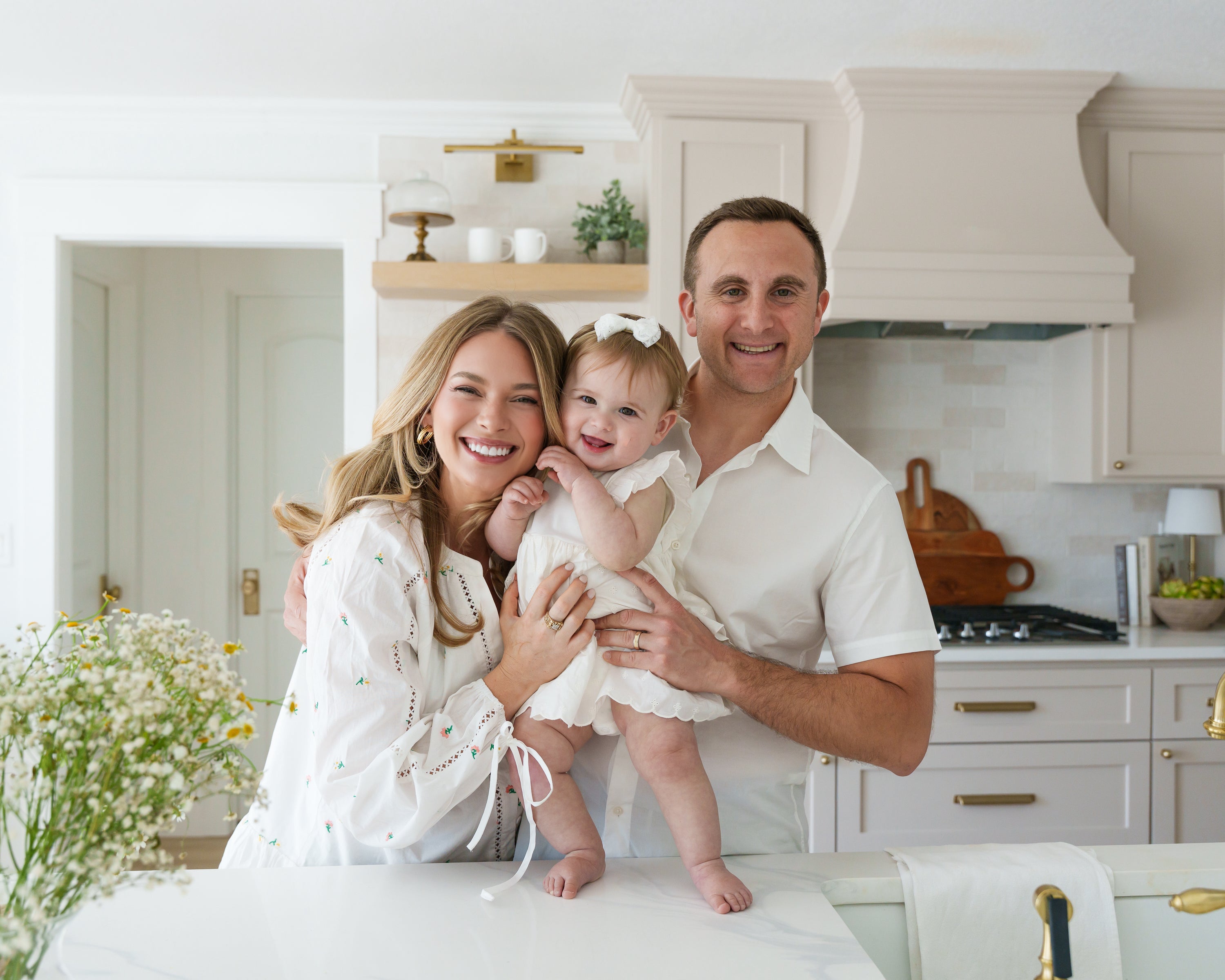 Photo of the founders with their baby daughter.